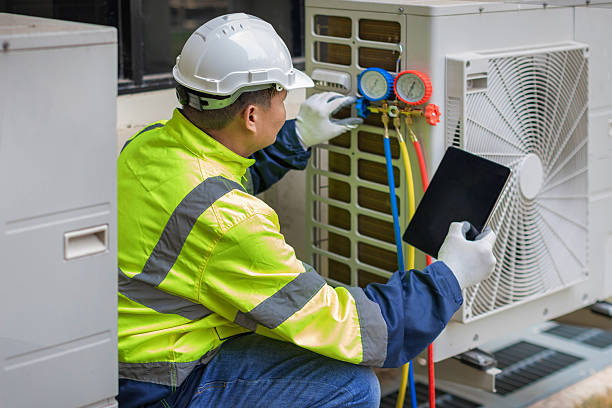 Professional Air Conditioning Repair technician working in DeWitt, MI